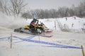 Rider snowmobile accelerates from the sharp turn