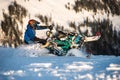 Rider on the snowmobile in the mountains. active drive