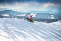 Rider on the snowmobile in the mountains