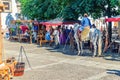 Rider warrior on horse and women in old traditional clothes in cobblestone square in historical town centre