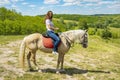 The rider on the white horse. Young horsewoman riding on white horse, outdoors view. girl on white horse runs free. toned