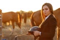 Rider woman with whip at the sunset Royalty Free Stock Photo