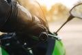 Rider with your hand on the throttle or brake on the handlebar of your motorcycle and your protective gear on. Copy space Royalty Free Stock Photo