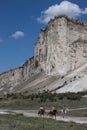 riders on the background of the cliff white rock crimea