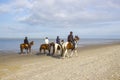 Riders on horses on the beach in Renesse, the Netherlan