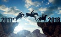 The riders on the horses jumping into the New Year 2018 Royalty Free Stock Photo