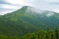 Ridge, covered by a coniferous forest, with mountain observatory Royalty Free Stock Photo