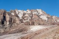 Ridge covered by snow at sunny weather and a glacier at Kazbek mountain, Georgia. Adventure, activesport concept. Copy