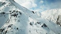 The ridge of a snowy mountain. Everything is covered with snow.