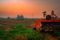 Ridging crackdown machine. Supply for tractor. Agricultural machinery in agriculture farm. Rice farm in morning with red sunrise