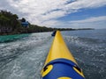 Riding banana boat at beach