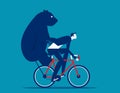 Riding a bicycle carrying a bear behind. Bear market concept