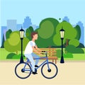 Riding bicycle public urban park man cycling wooden bench street lamp green lawn trees on city buildings template Royalty Free Stock Photo