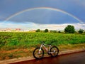 Riding the bike to the rainbow after rain