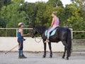 Riding girl and horse Royalty Free Stock Photo