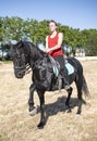 Riding girl and horse Royalty Free Stock Photo