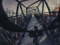 Riding a gravel bicycle through a bridge