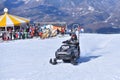 Riding High - Snowmobiler Takes to the Slopes on a Sun-Drenched Day in winter Royalty Free Stock Photo