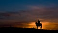 Riding a horse in sunset