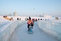 Harbin Ice Festival 2018 - Riding the Ice bike- ice and snow buildings, fun, sledging, night, travel china Royalty Free Stock Photo