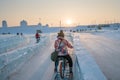 Harbin Ice Festival 2018 - Riding the Ice bike- ice and snow buildings, fun, sledging, night, travel china Royalty Free Stock Photo