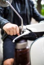 Riding motorcycle, close up of hand on handlebar of scooter Royalty Free Stock Photo