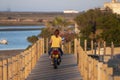 riding a motorcycle on wood path