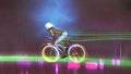 Riding a mountain bike with neon lights Royalty Free Stock Photo