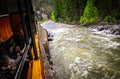 Riding the narrow gage train between Durango and Silverton Colorado right beside rushing river Royalty Free Stock Photo