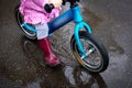 Riding in the rain through puddles on a blue Bicycle Royalty Free Stock Photo