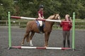 Riding school pupil and instructor Royalty Free Stock Photo