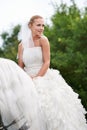 Riding to meet her white knight on the special day. A gorgeous young bride riding a white horse on her wedding day. Royalty Free Stock Photo