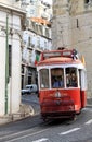 Riding tram in narrow, curvy street, Lisbon