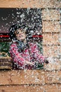 Girl with cow girl costume throwing confetti