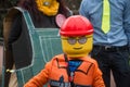 portrait of people with lego costume parading in the street