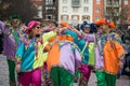 People parading in the street with colorful costume of harlequin