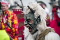 People parading in the street with scary mask