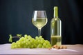 riesling wine glass with clear bottle and green grapes Royalty Free Stock Photo