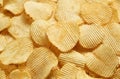 Riffle golden chips with texture potato background