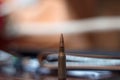 Rifle ammo on blurred background. Royalty Free Stock Photo