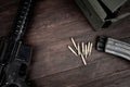 Rifle and Ammunition with magazine on wooden table Royalty Free Stock Photo