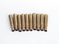 Rifle bullet shell casings on white background Royalty Free Stock Photo