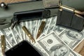 Rifle, magazine and cartridges on money. Concept for crime, contract killing, paid assassin, terrorism, war, global arms