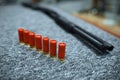 Rifle and row of ammo in gun shop, closeup, nobody Royalty Free Stock Photo