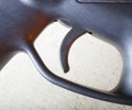 Rifle trigger with orange highlights Royalty Free Stock Photo