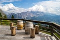 Rifugio Duca D`Aosta with wooden barrels as tables for tourists taking a break in the Italian Dolomites mountains