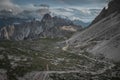 Rifugio Lavaredo mountain cabin with hiking trail in front of Dolomite Alps mountains at Three Peaks in Italy from above