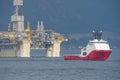 Rig move of Equinor oil platform Njord Alpha with ahts vessel Siem Pearl innside the Norwegian fjord. Royalty Free Stock Photo