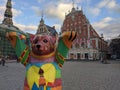 Riga Bear on the Town Hall Square on the background of the House of the Blackheads