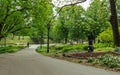 Riga city central park green view, sitting lady statue Royalty Free Stock Photo